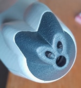 Close up view of the nozzle with imaging aperture and light pipe terminations visible.