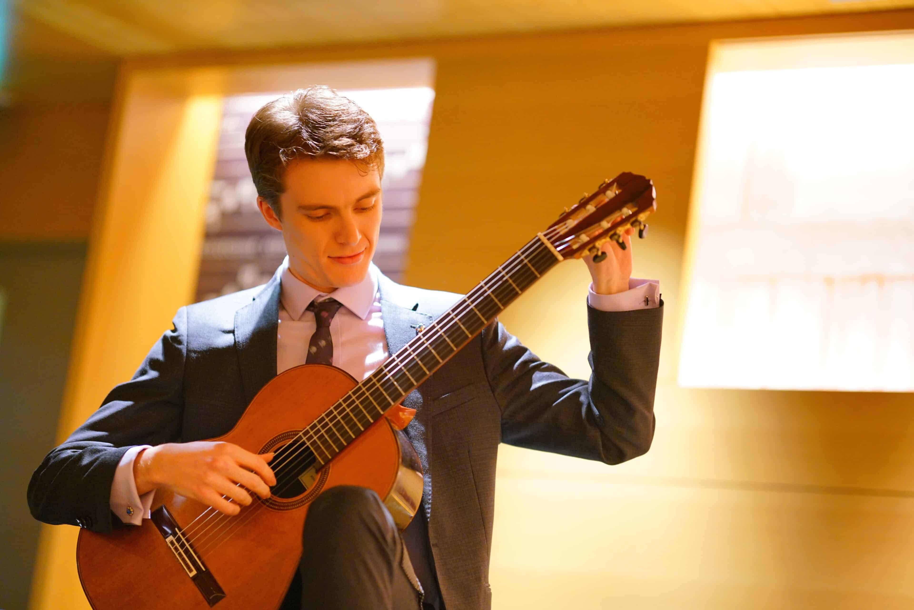 EMMANUEL SOWICZ playing guitar